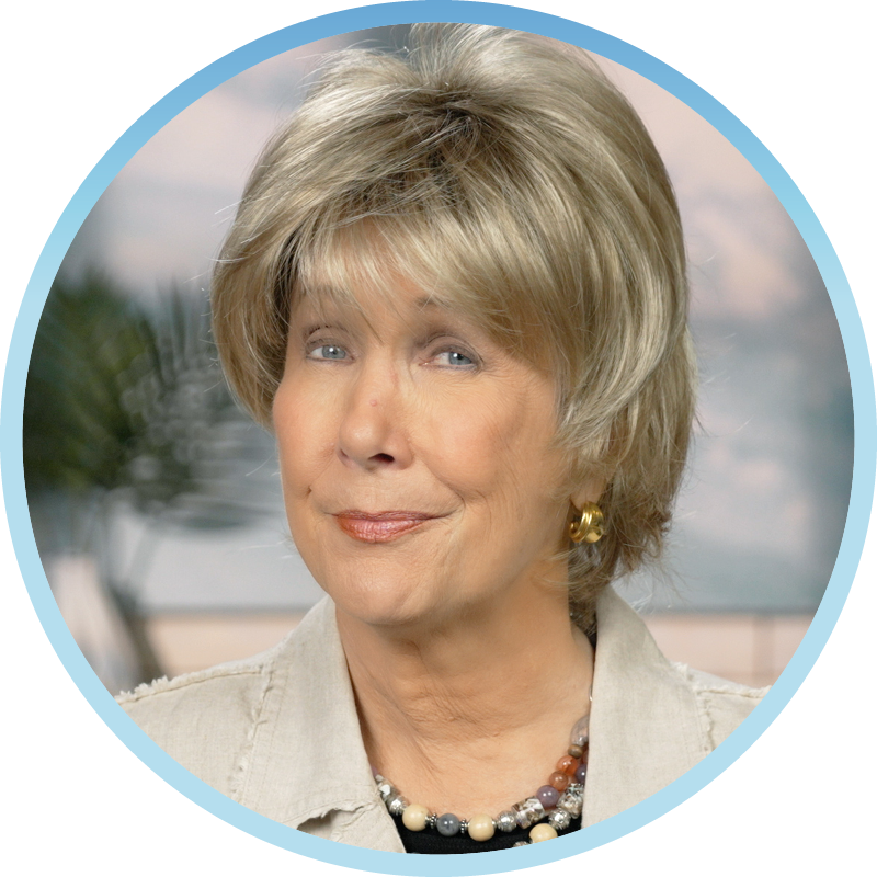 A front view photo of Joni Eareckson Tada smiling for the camera. The image is framed in a circular shape.