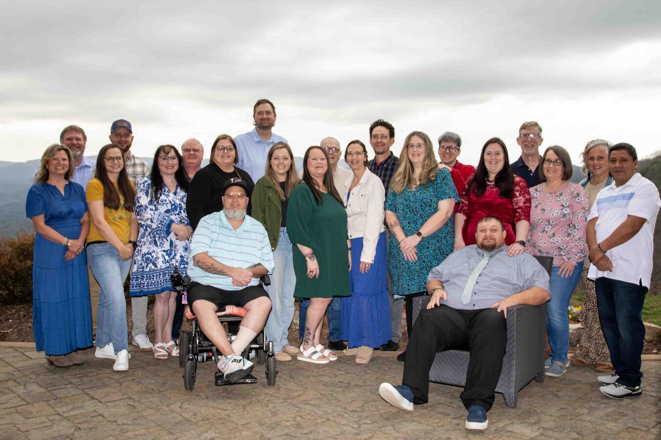 Jennifer and Michael Clayton with other couples at a Marriage Getaway in Georgia, smiling and posing outdoors with a beautiful scenic view in the background
