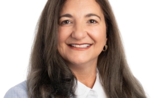 A headshot of Tamara Broad smiling for the camera.