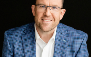 A headshot of Connor Bales smiling for the camera.