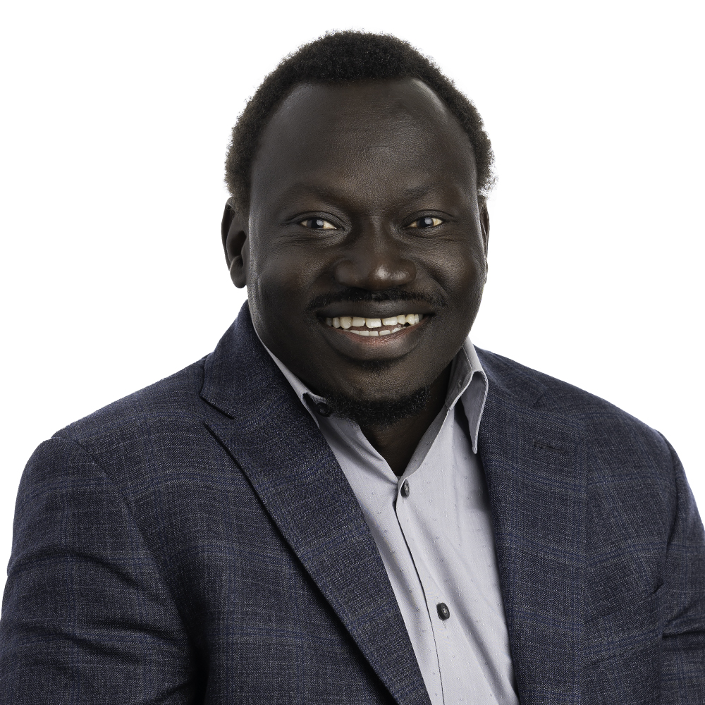 25_Michael_Panther_web Headshot of Michael Panther smiling for the camera.