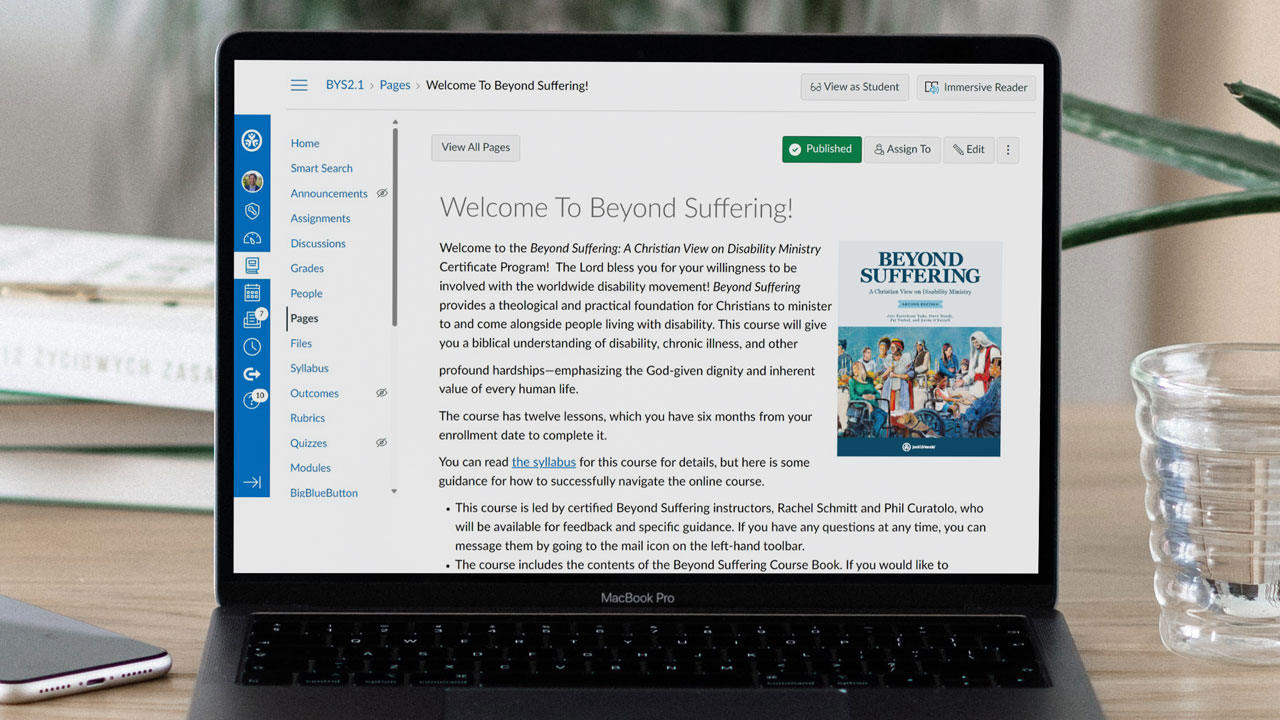 A laptop featuring the Beyond Suffering Second Edition online course.