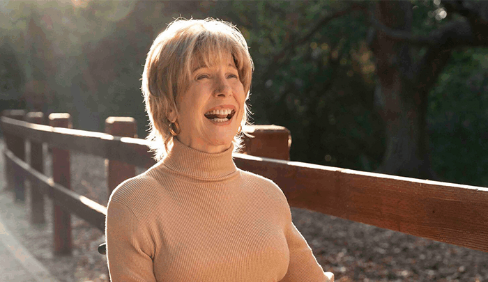 Joni smiling with warmth and peace, reflecting her faith and courage.