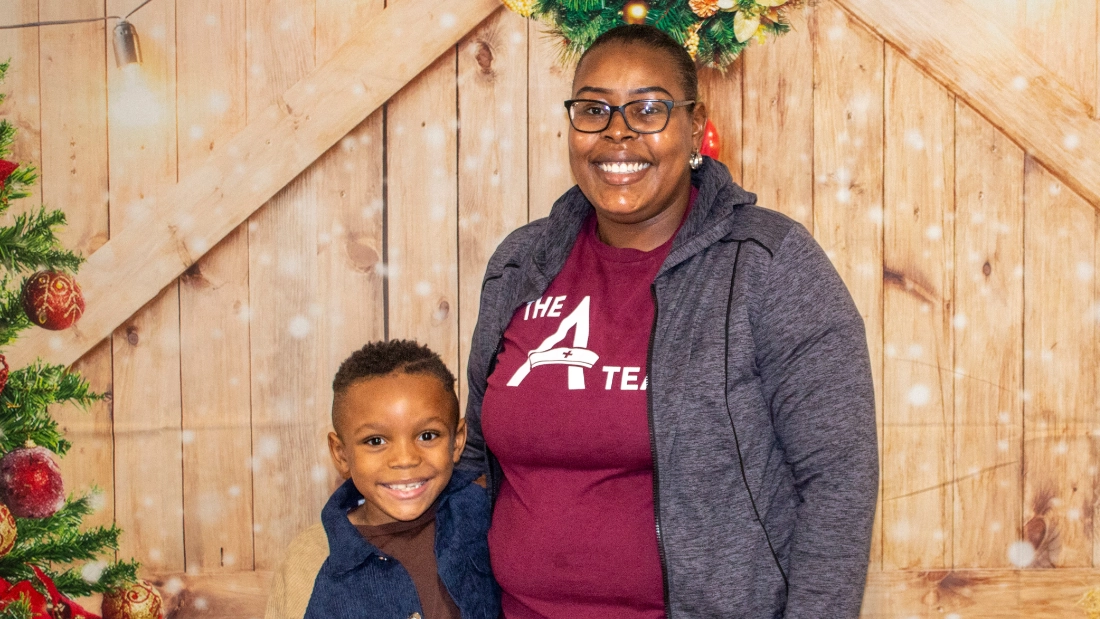 A mother a son posing for a photo