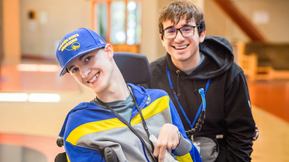A camper and volunteer at Family Retreat