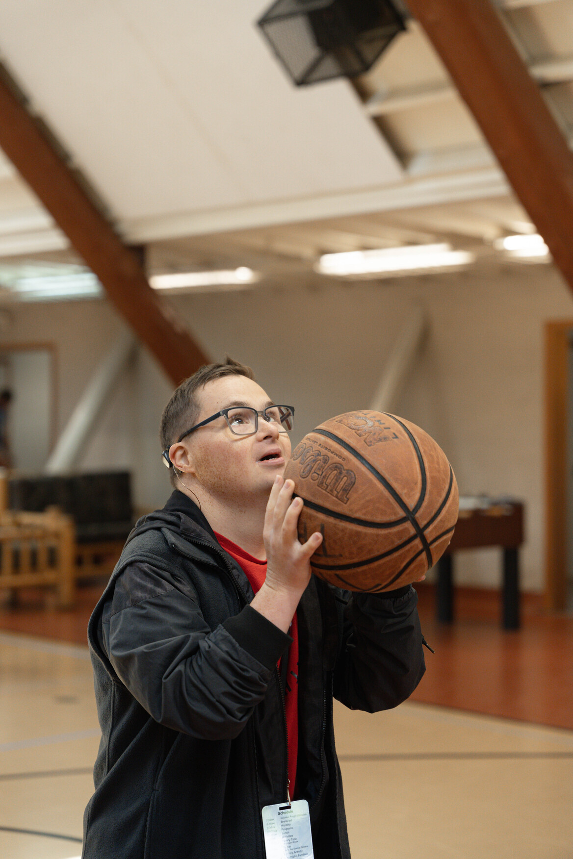 Paul posing in a position to shoot a basketball.