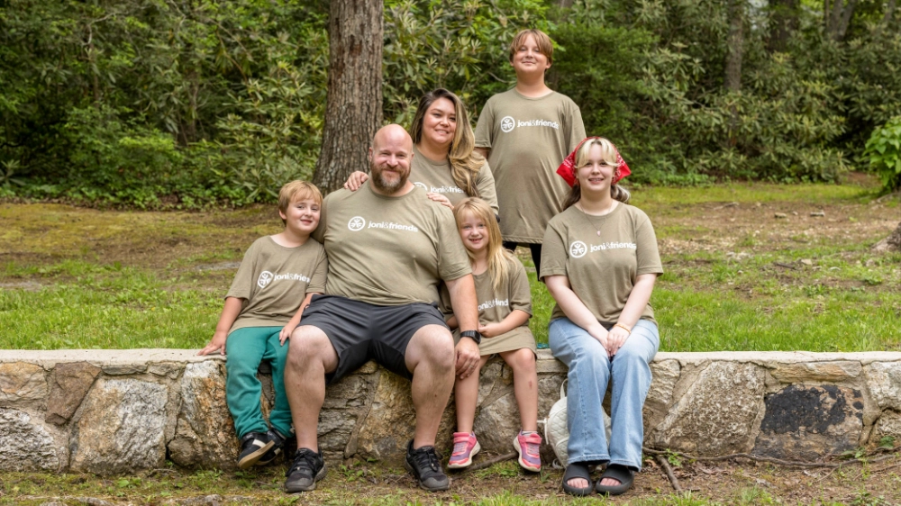 A family poses for a photo at Warrior Getaway