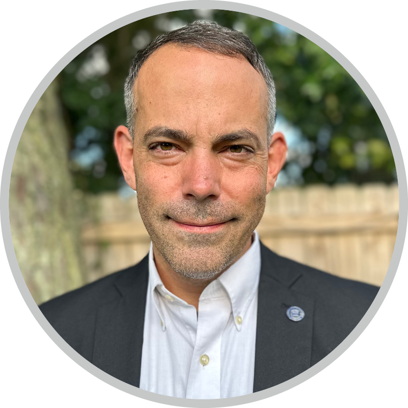 A headshot of Matt McCraney smiling for the camera.
