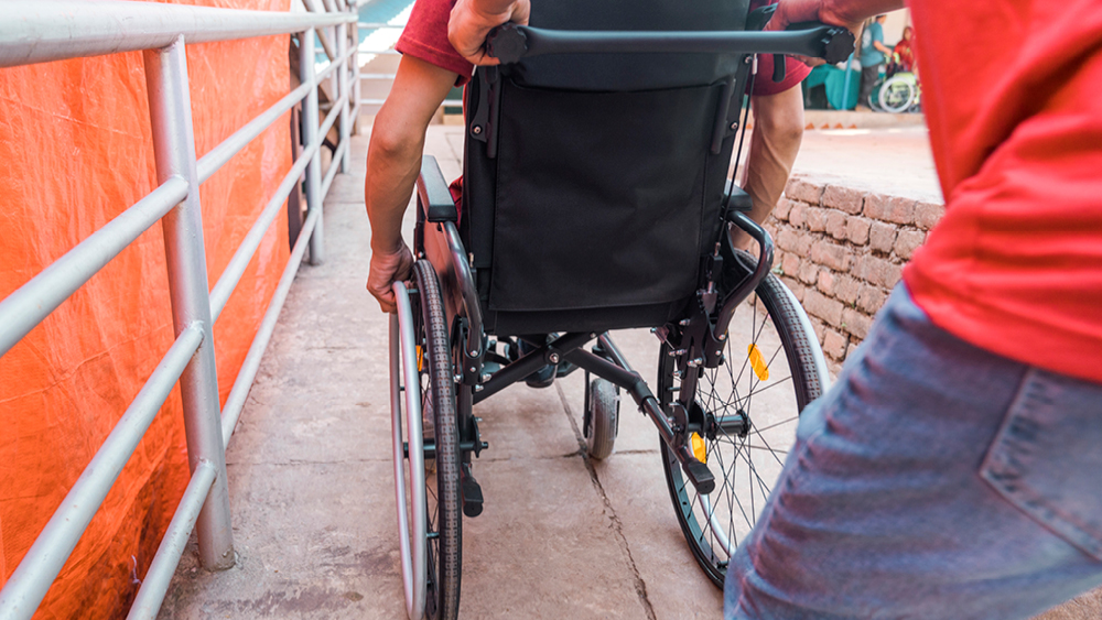 A person rolling in their new wheelchair