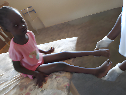 Kesna sitting on a raised mat.