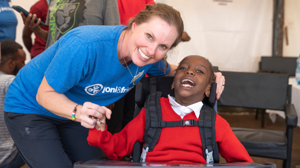 Joni and Friends Internships An intern and child in a wheelchair post for a photo