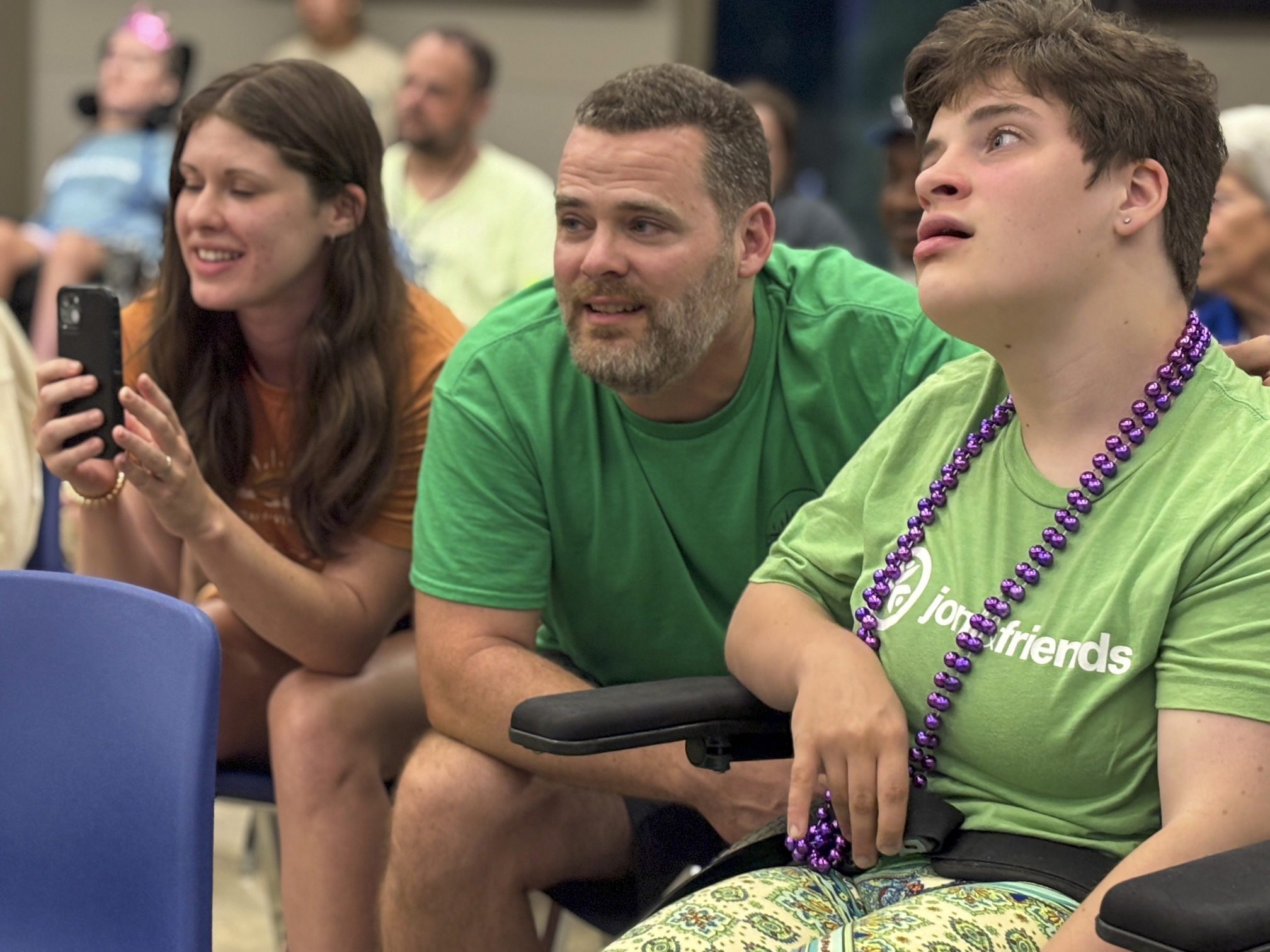 David, Mikaela, and Rebekah are having a great time during the Family Retreat Talent Show.
