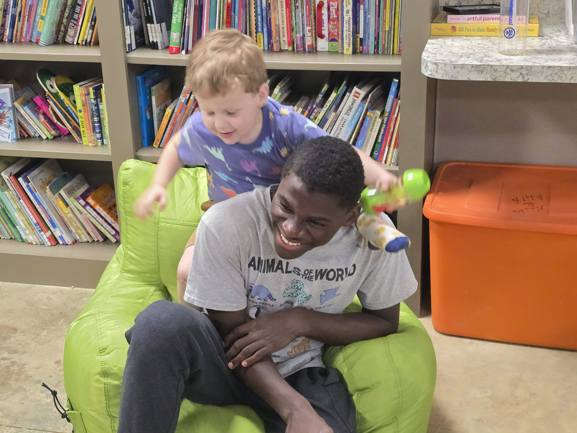 Asher brings joy by playing with another young camper.