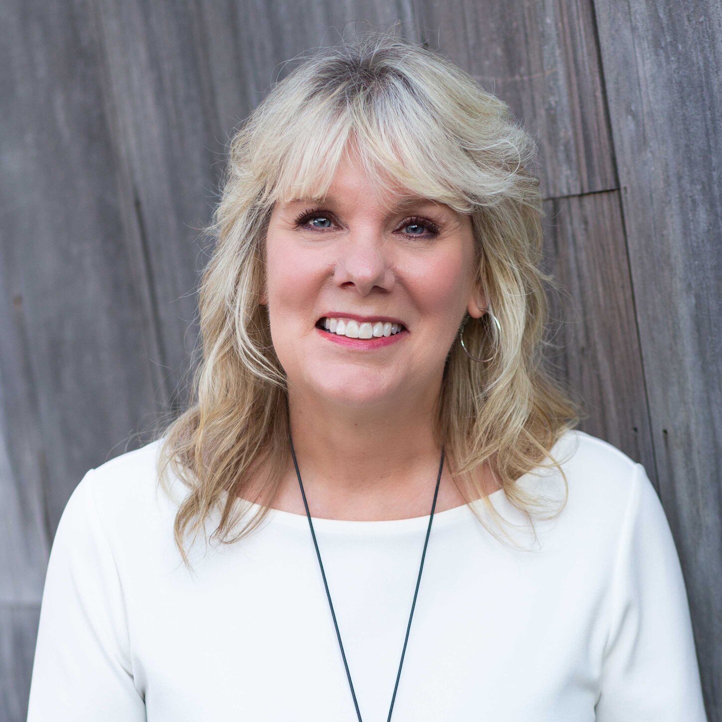 A headshot of Jayme Durant smiling for the camera.