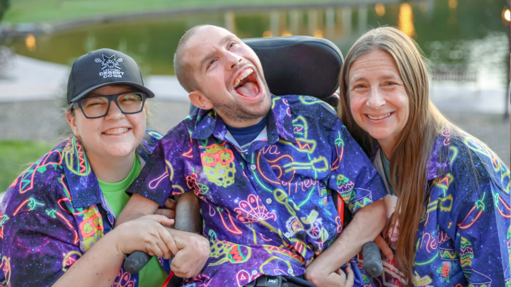 Campers and volunteers pose for a photo at Family Retreat