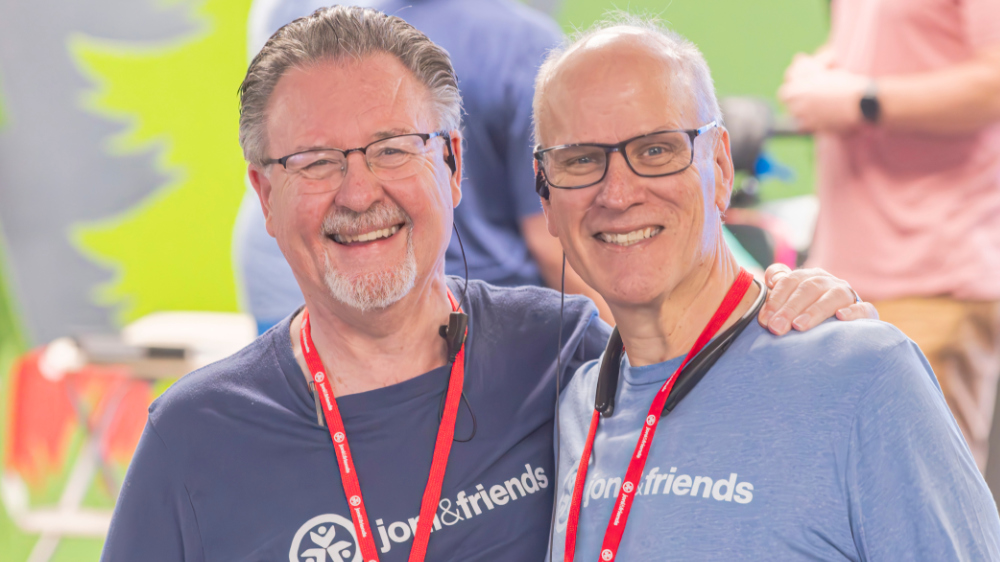 Two men pose for a photo at a Joni and Friends event
