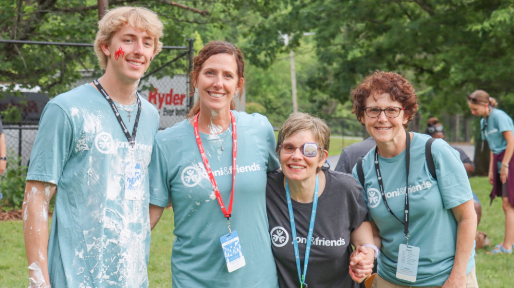A group of volunteer pose for a photo at Family Retreat