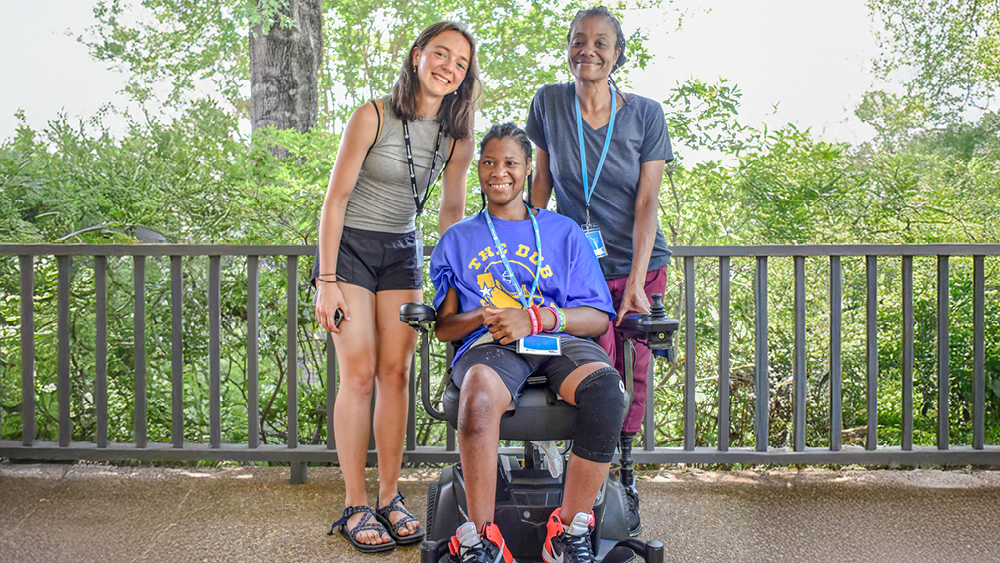 Campers and volunteers pose for a photo at Family Retreat