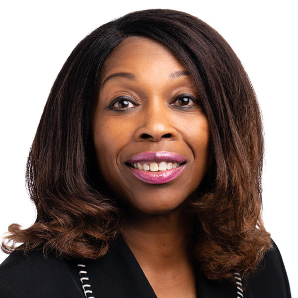 A headshot of Cece McCoo smiling for the camera.