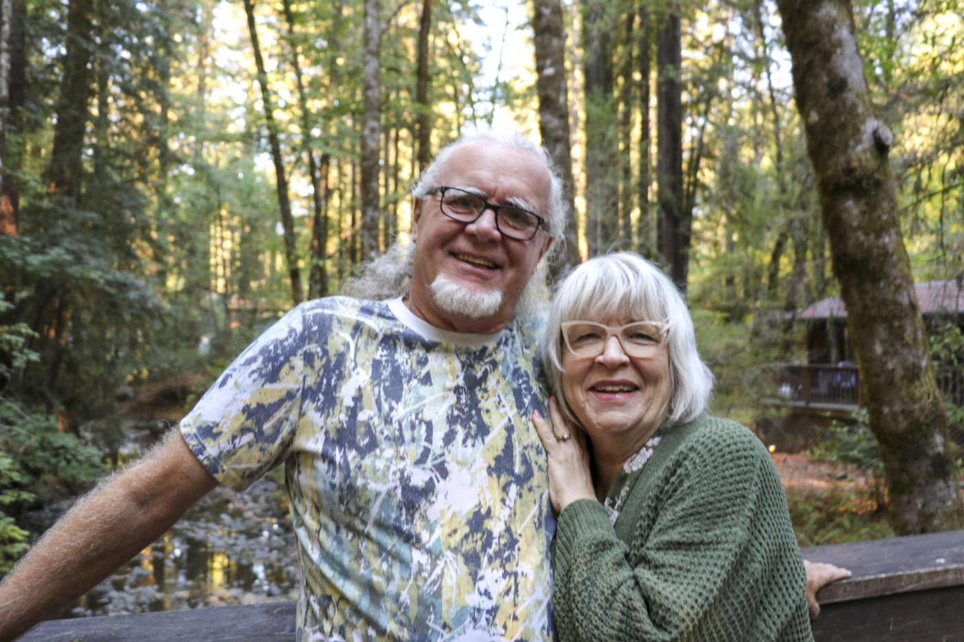 Darrell and Donnell posing with tall trees behind them.