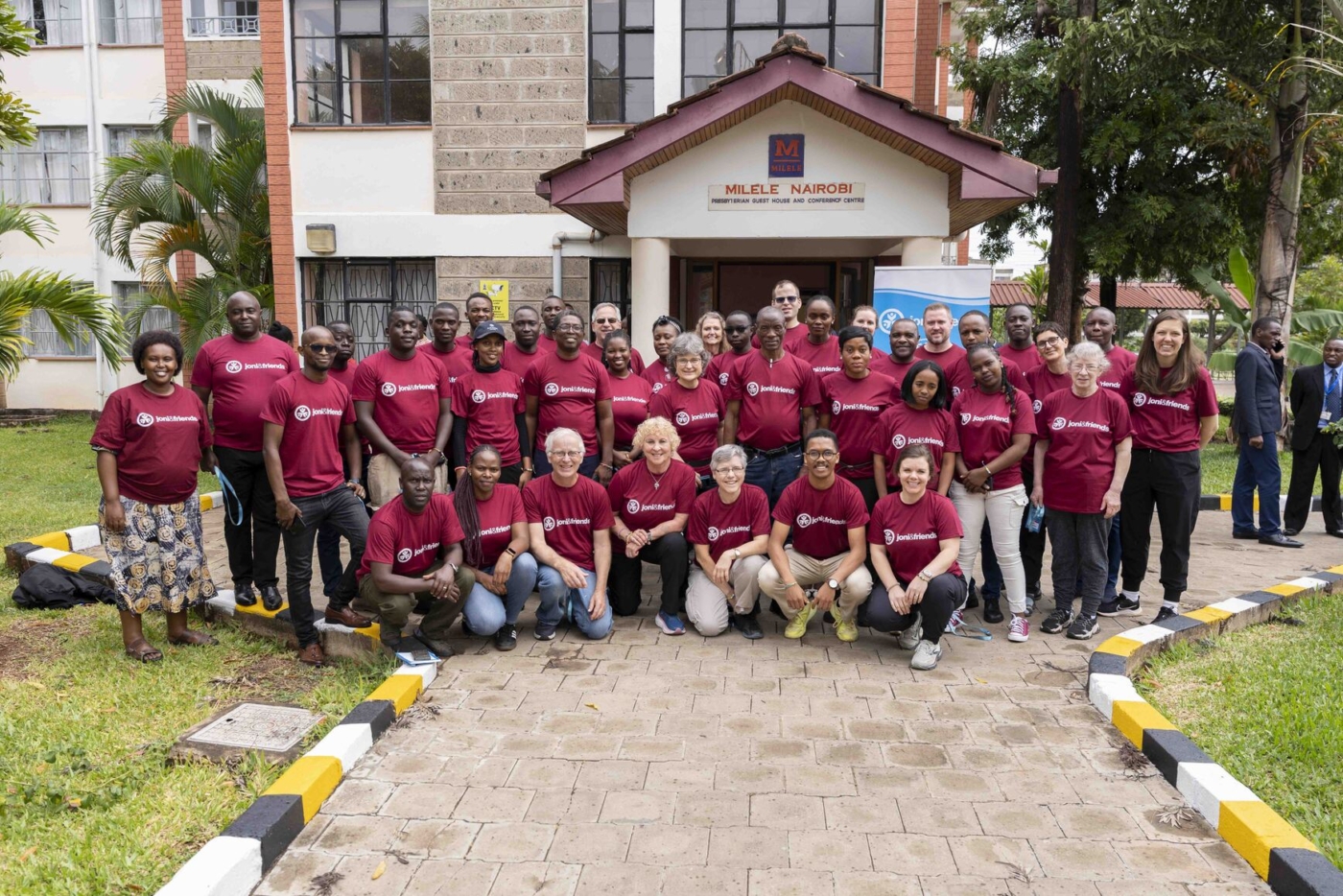 A group of volunteers, staff, and interns from Joni and Friends posing together for a photo in Kenya.