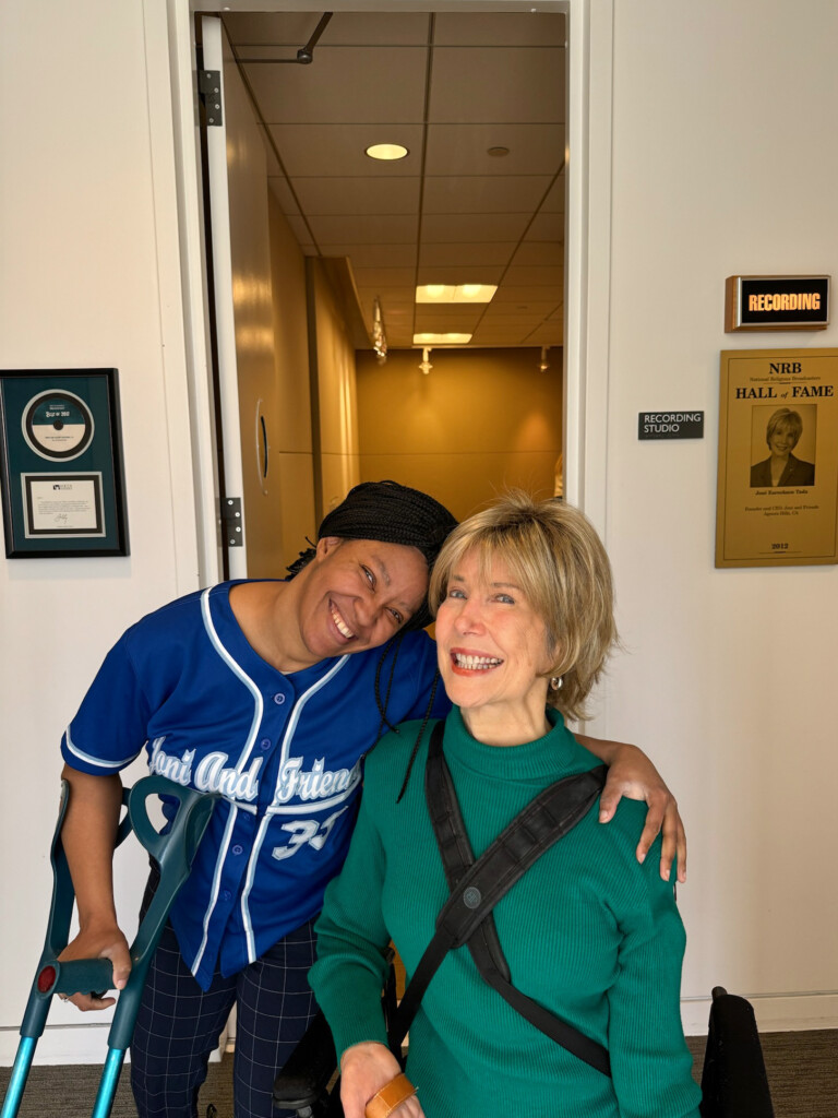 Celeste and Joni pose for a photo in front of the Radio studio