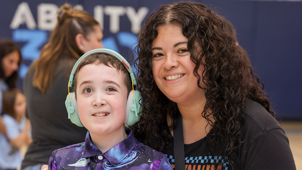 People joyfully pose for a photo at a Joni and Friends events