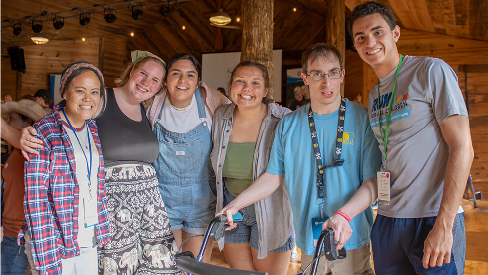 A group of people pose for a photo at a Joni and Friends event