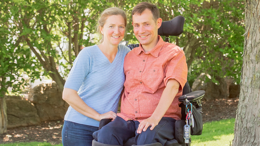 A couple poses for a photo at Marriage Getaway