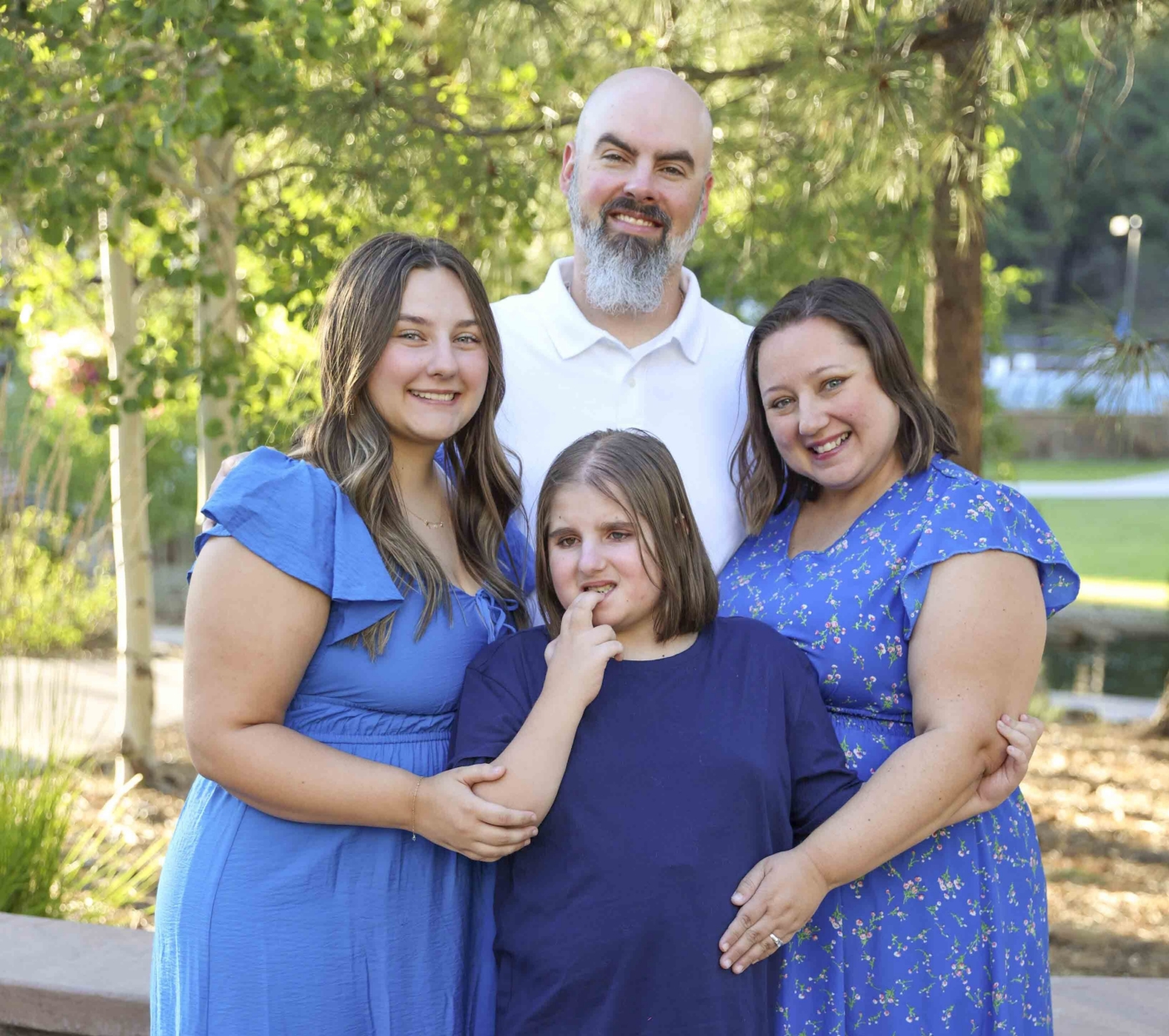 Dan, Brandi, Andi, and Savannah posing together for the camera.
