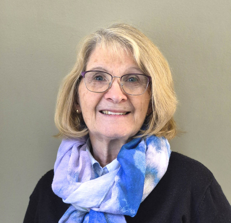 Ramona Brown Monsour smiling and posing for the camera.