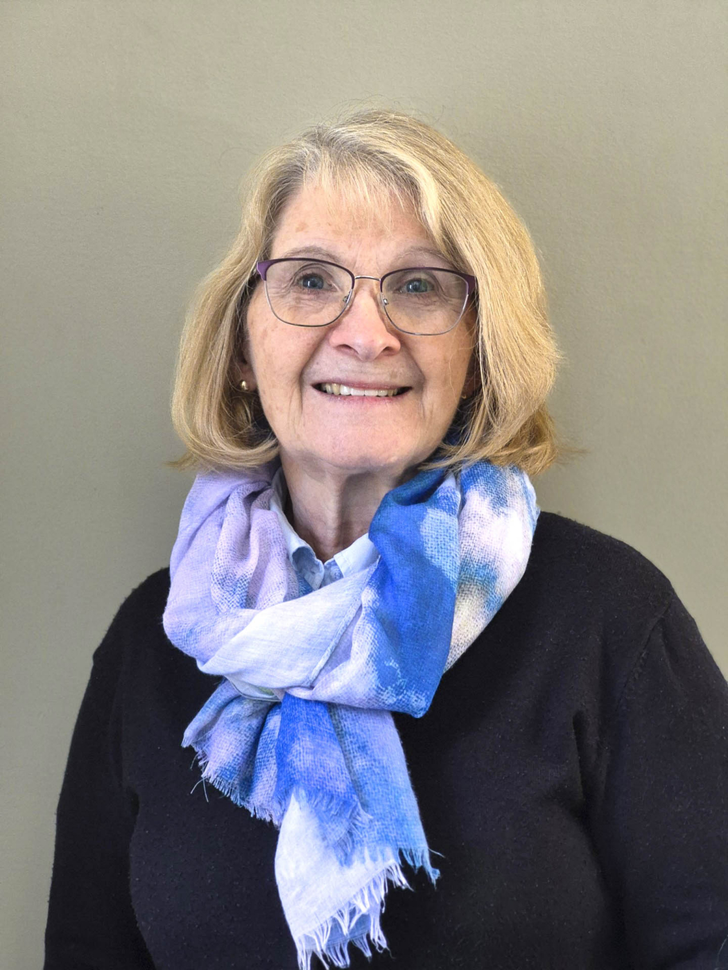 Ramona Brown Monsour smiling and posing for the camera.