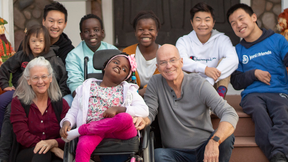 A group of people pose for a photo at a Joni and Friends event