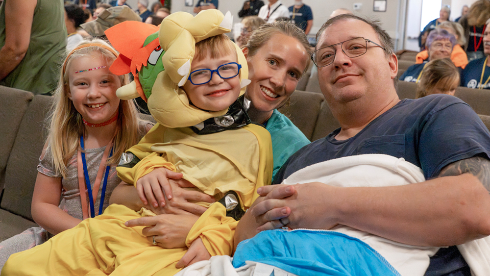A family poses for a photo at Warrior Getaway