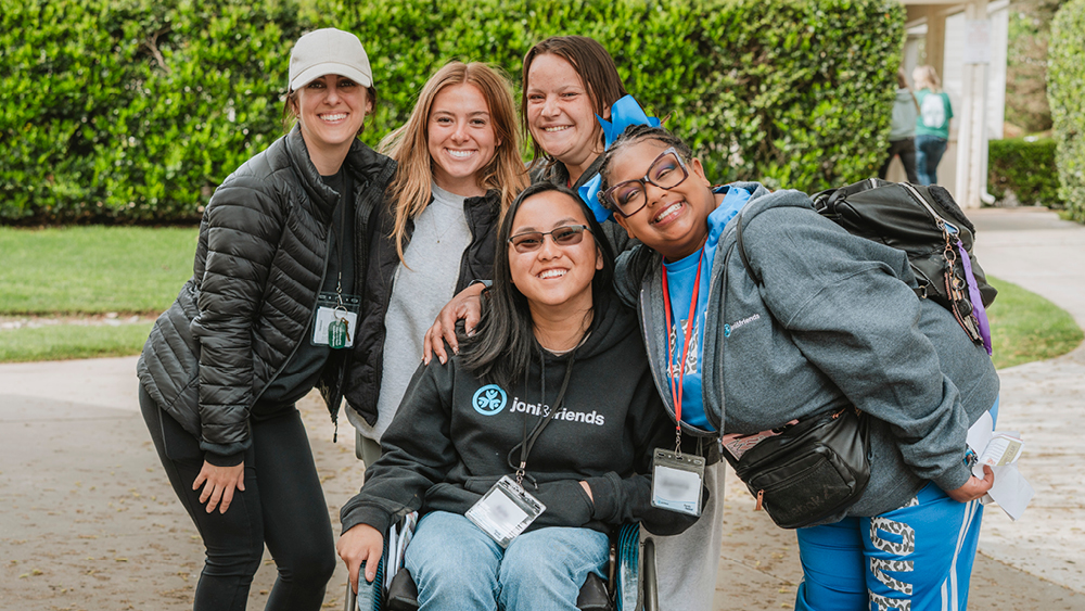 People pose for a photo at a Joni and Friends event