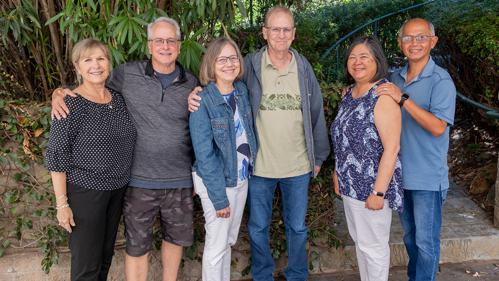 Married couples pose for a photo at a Marriage Getaway