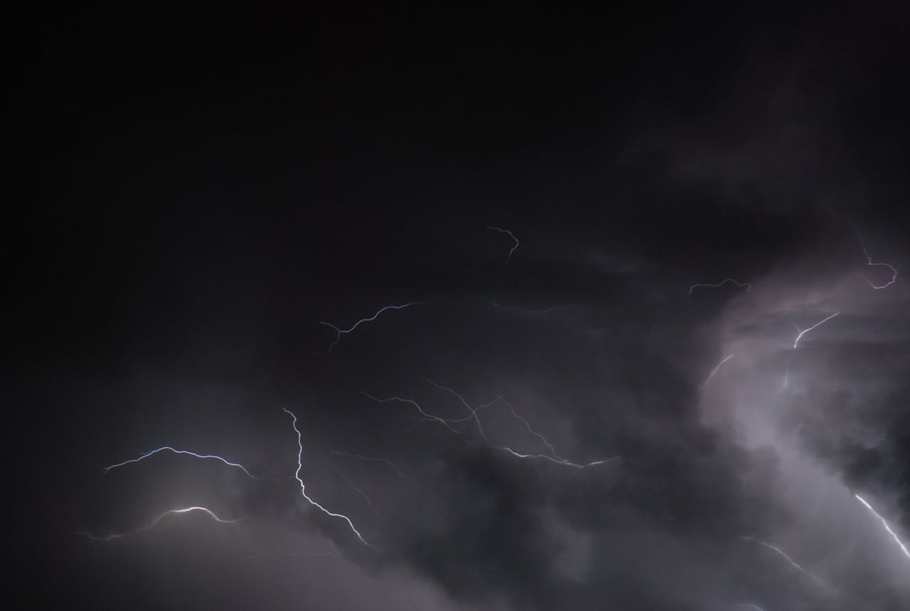 Dark storm clouds with lightning in the sky.