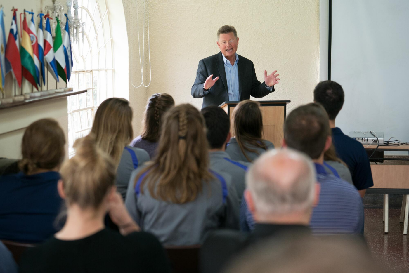 Steve Bundy speaking in front of a people