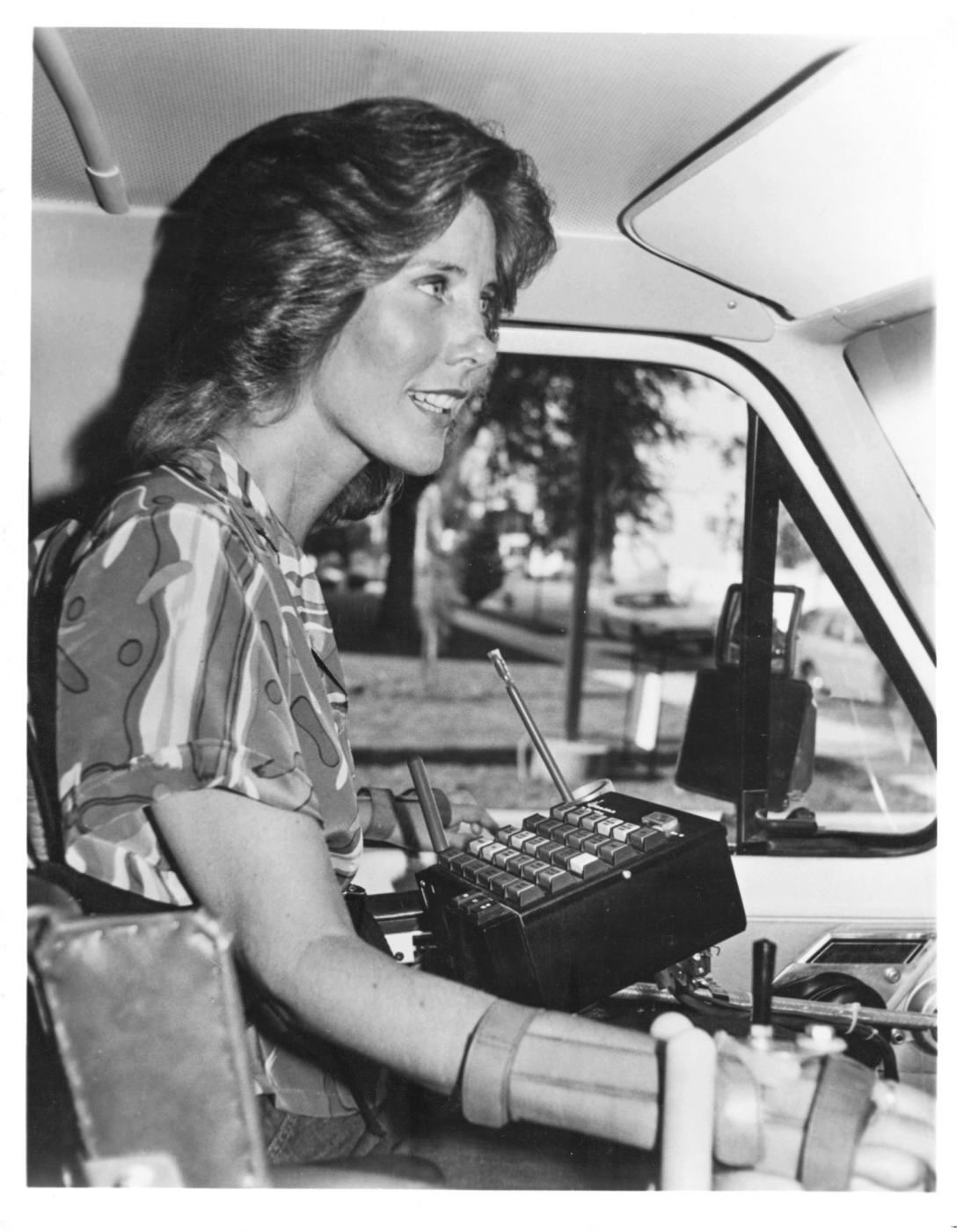 Joni is driving a car