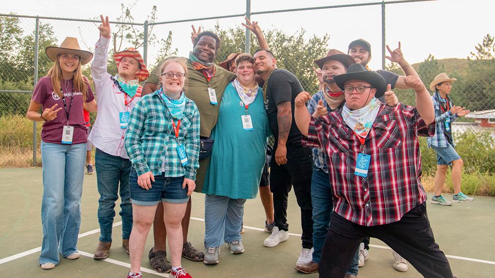People pose for a photo in western attire at a Joni and Friends event
