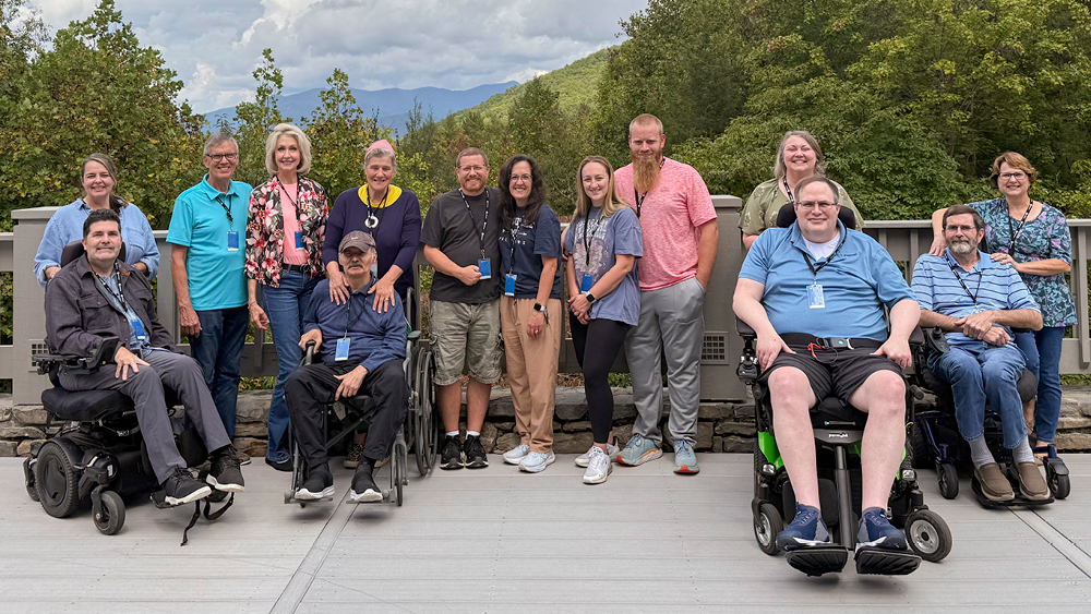 Married couples pose for a photo at a Marriage Getaway