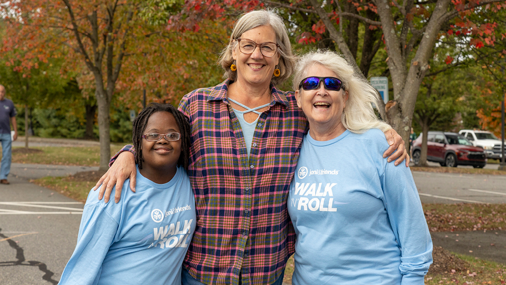 People pose for a photo at a Walk 'N' Roll event