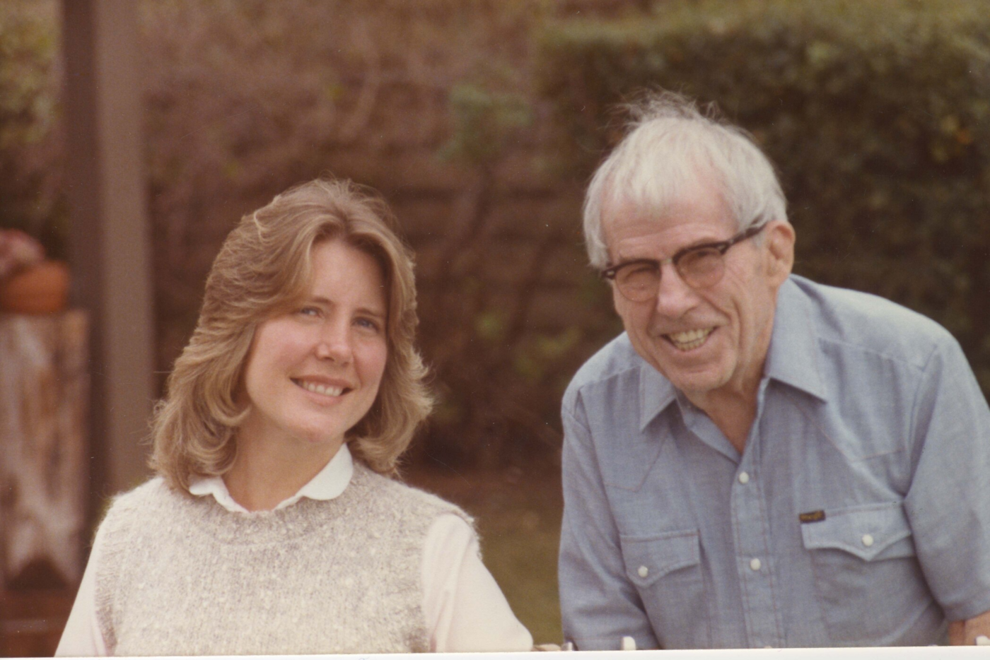 Joni Eareckson Tada smiles while posing beside her father, John Eareckson.