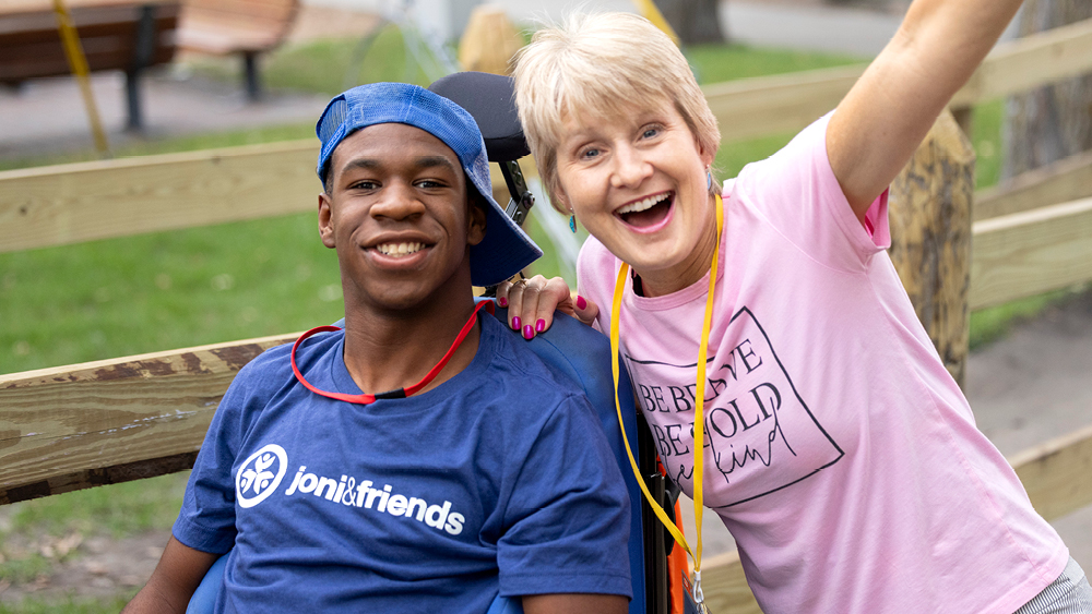 Two people pose for a photo at a Joni and Friends event
