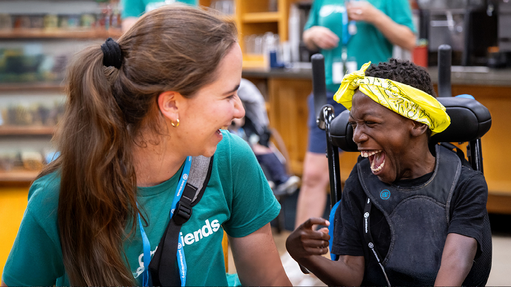 Two people smile at each other
