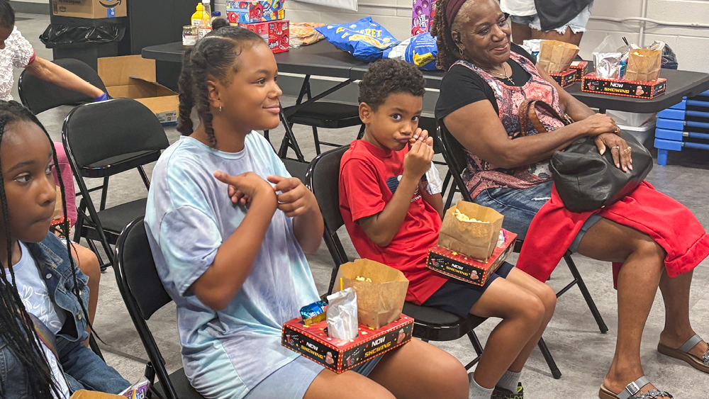 People watching a show with snack boxes