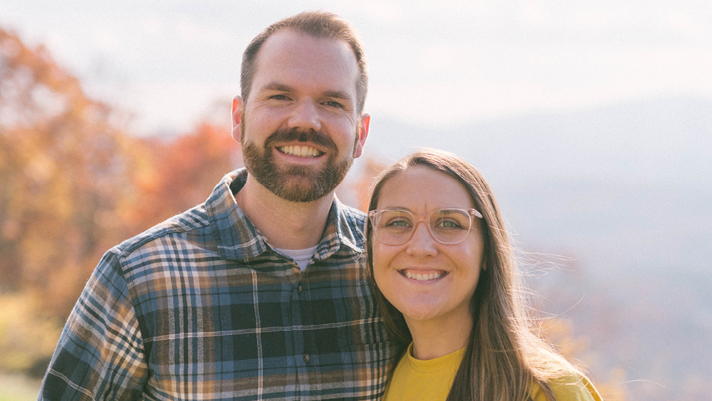 A couple poses for a photo at a Marriage Getaway