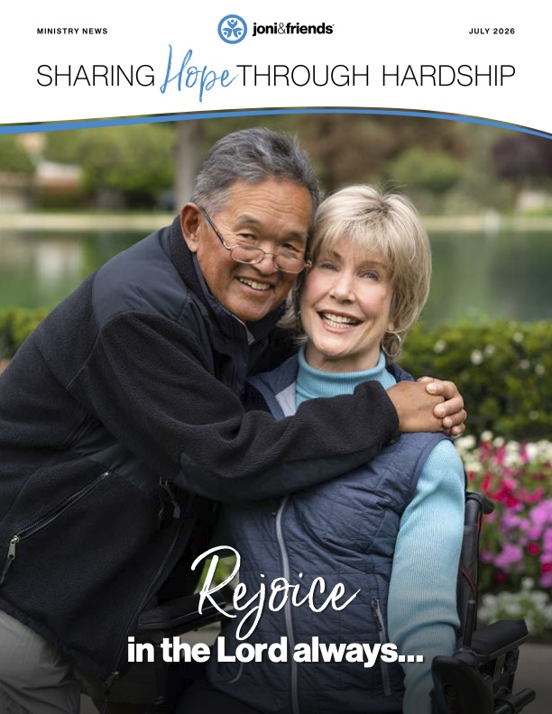 Newsletter cover for July 2026 featuring Ken hugging Joni. The title reads "Sharing Hope Through Hardship," and the bottom features the quote, "Rejoice in the Lord always..."