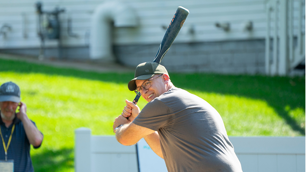 A man getting ready to swing a baseball bat