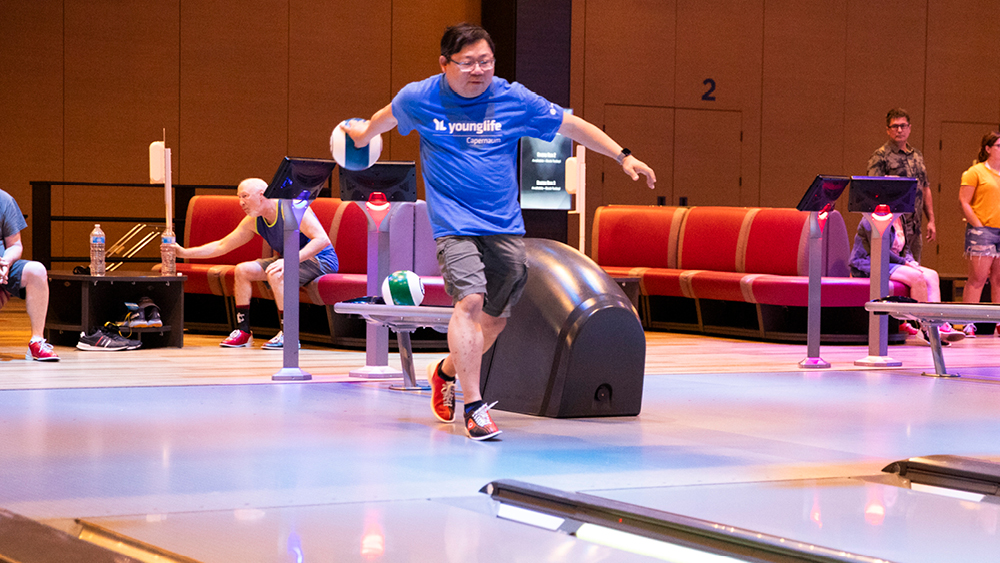 A man gets ready to roll a bowling ball
